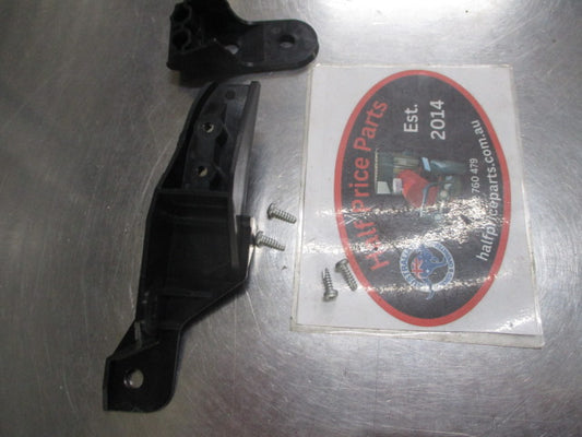 Mitsubishi Pajero Genuine left hand headlight brackets new part