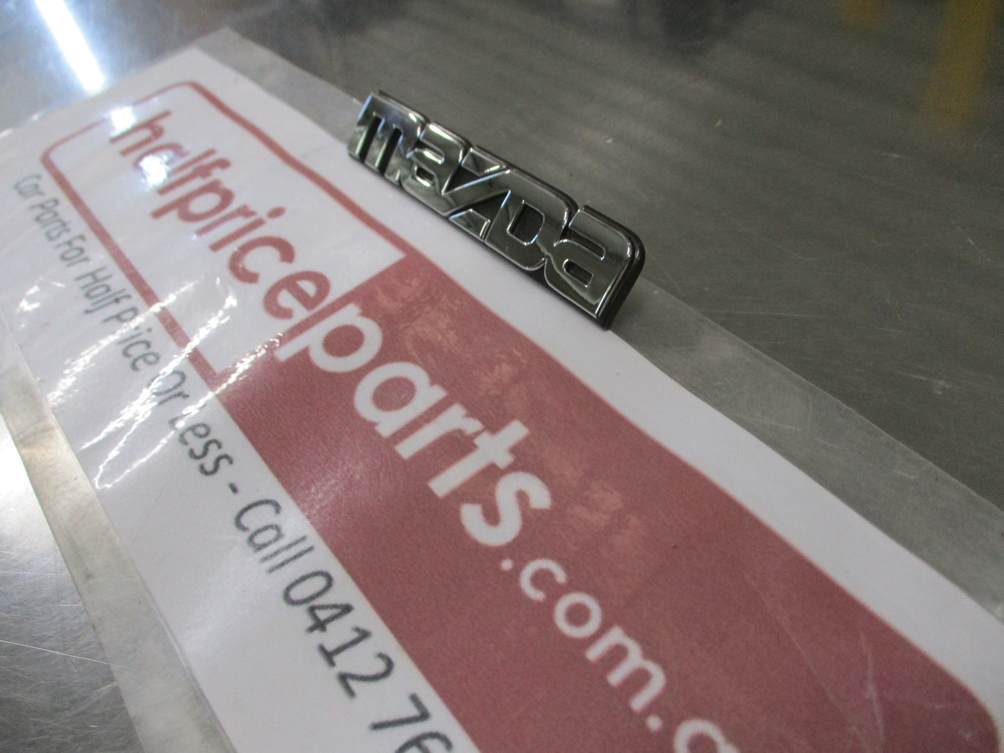 Mazda Protege Genuine Rear Emblem Badge (Chrome And Black) New Part