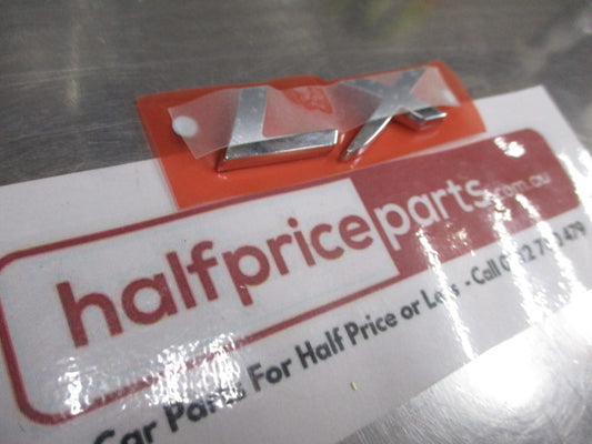 Mitsubishi Lancer Genuine Rear Chrome LX Emblem New Part