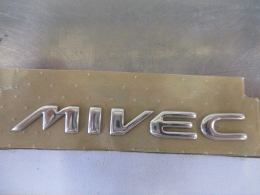 Mitsubishi MIVEC Genuine Rear Chrome Badge New Part