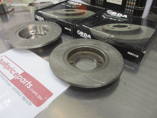 RDA Front Disc Brake Rotors (Pair) Slotted-Dimpled Suits Datsun Stanza New Part