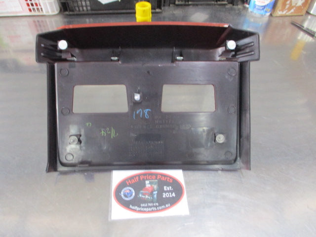 Mitsubishi Pajero Genuine Back Door License Plate Moulding (Factory Burgundy) New Part