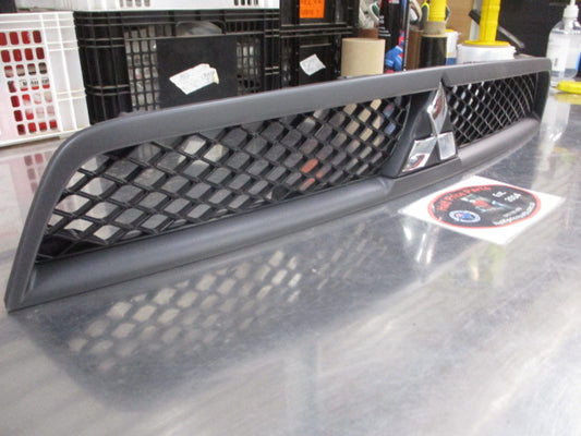 Mitsubishi CJ Lancer Genuine Upper Front Grille Assembly With Emblem New Part