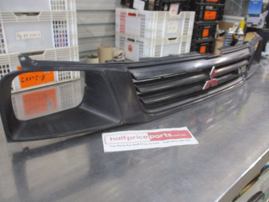 Mitsubishi MK Triton Genuine Front Grille Assembly With Head Light And Emblems Used Part