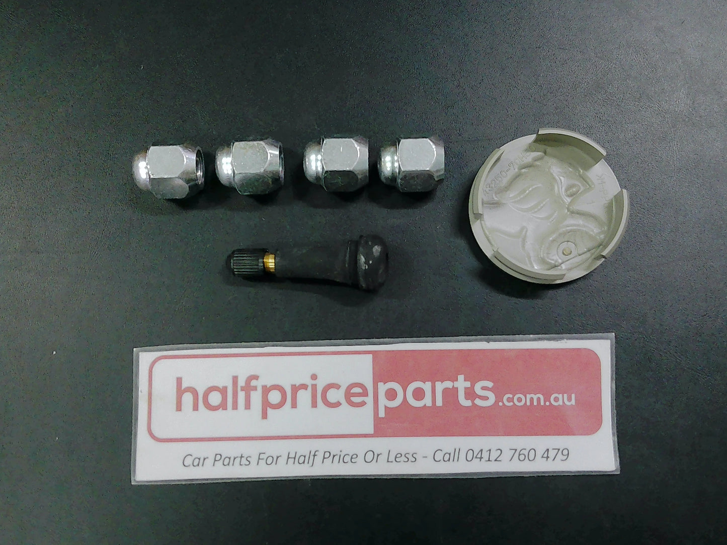 Holden YG Cruze Genuine Alloy Centre Cap/Valve And Wheel Nuts New Part