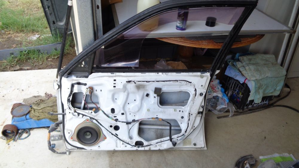 USED Right (Driver) front door shell to suitable for Toyota Corolla Sedan VGC