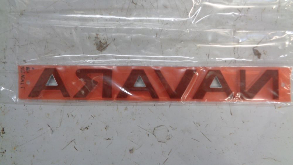 Nissan Navara D40M Genuine tailgate emblem new part