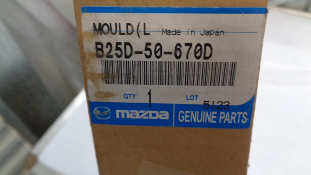 Mazda Protege /5 Genuine passenger rear door belt moulding new