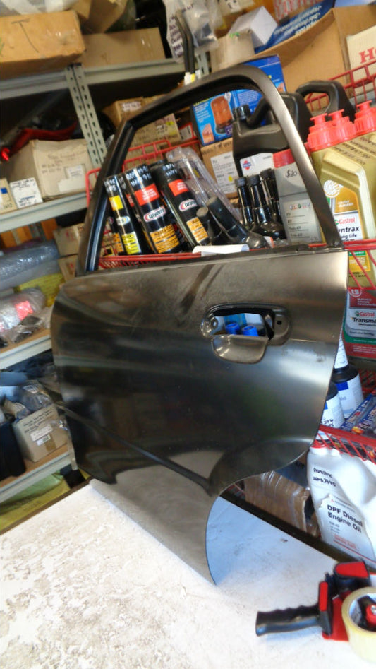 Ford Laser KN-KQ Genuine left hand rear door sedan new part