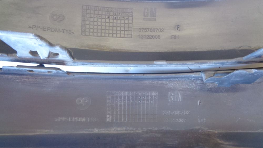 Holden Astra Genuine rear bumper bar mouldings left & right Used VGC
