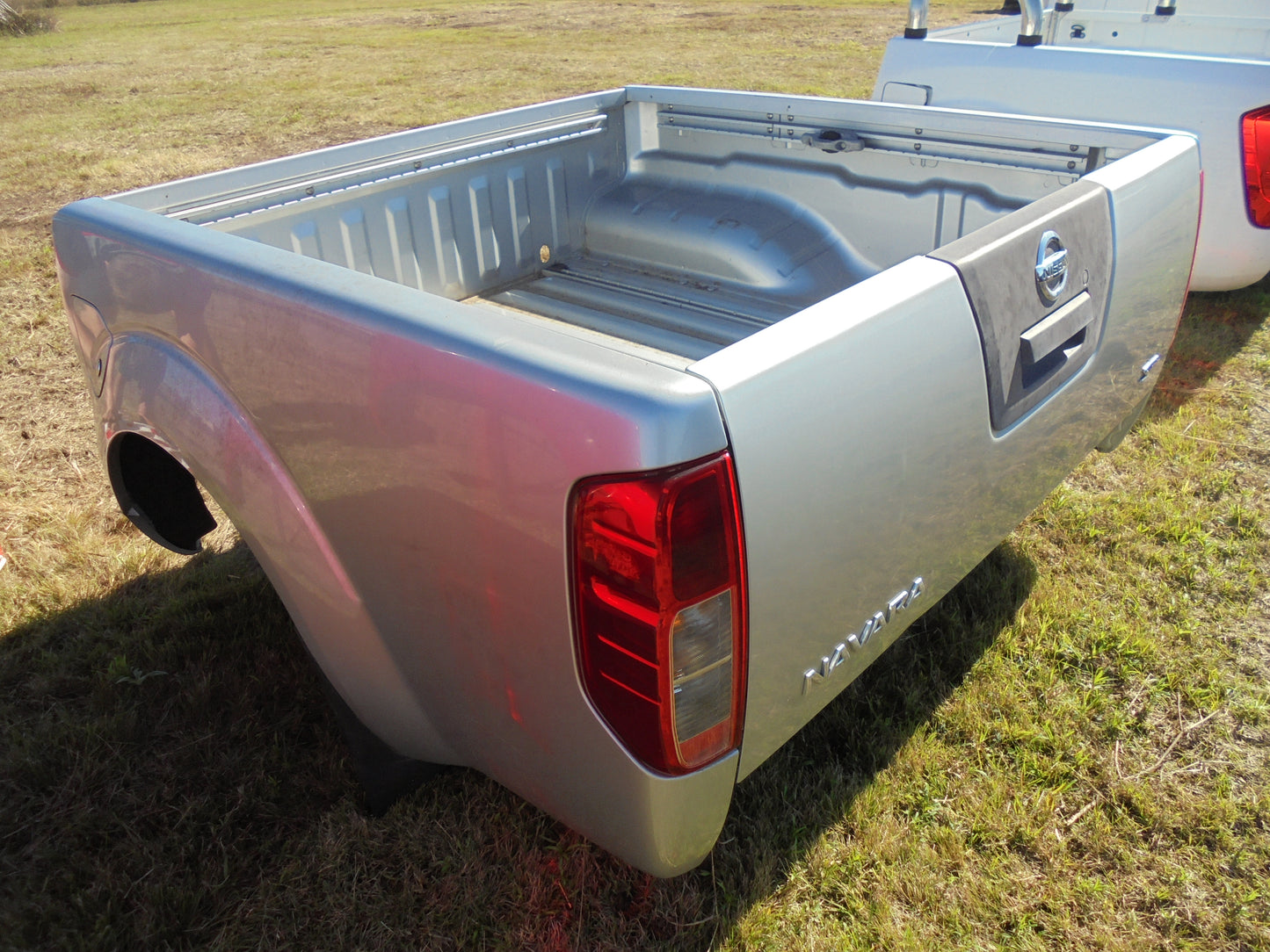 Nissan Navara ST dual cab tub silver in colour with alloy roll bar