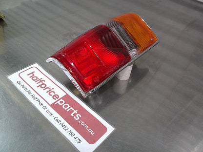 Toyota Hilux SR5 Genuine Left Hand Rear Tail Light Chrome Trim Tub Only New Part
