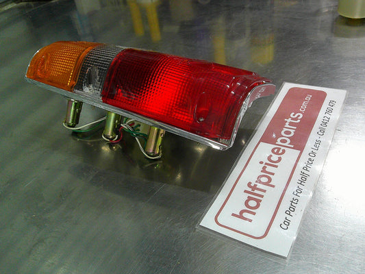 Toyota Hilux SR5 Genuine Left Hand Rear Tail Light Chrome Trim Tub Only New Part