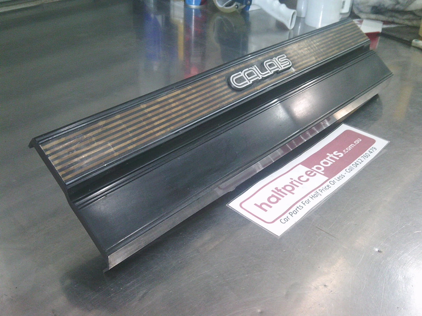 Holden VL Calais Genuine Rear Tail Light Garnish With Brackets Used Part