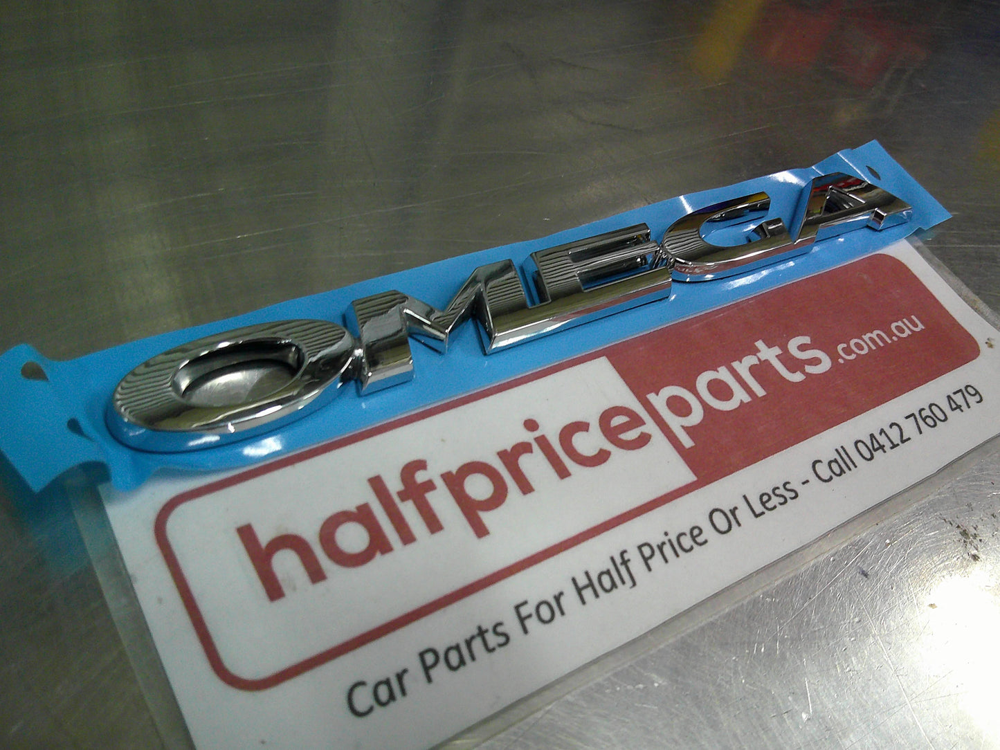 Holden VE Commodore Omega Genuine Chrome Boot Lid Emblem New Part