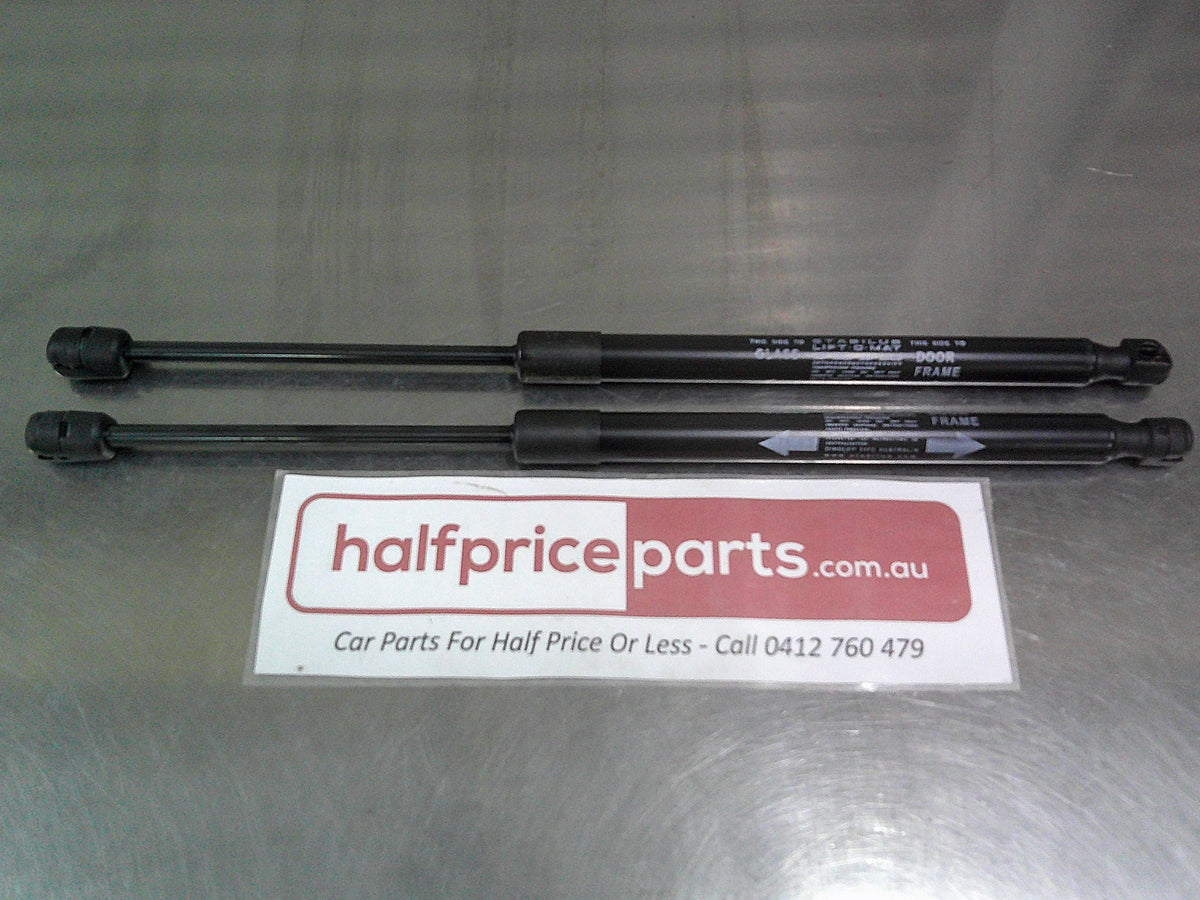 Toyota Hilux Genuine Rear Canopy Door Struts (Sold As Pair Only New Part