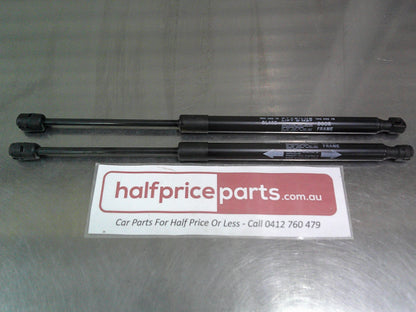 Toyota Hilux Genuine Rear Canopy Door Struts (Sold As Pair Only New Part