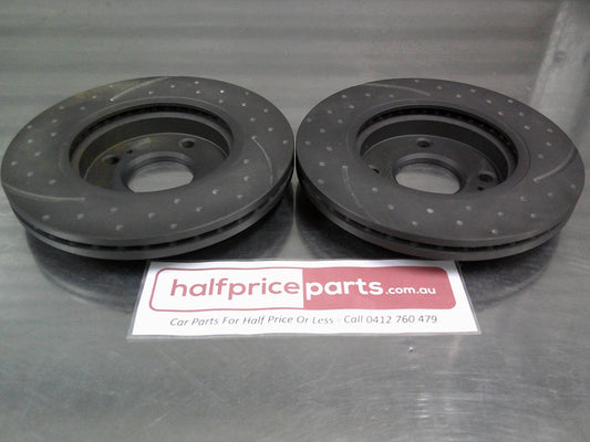 RDA Front Disc Rotors Slotted/Dimpled Suits Ford WT Fiesta (Sold As Pair Only) New Part