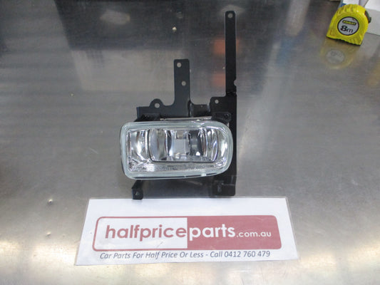 TYC Left Hand Fog Light With Mounting Frame Suits Mazda 323 Protege Sedan New Part