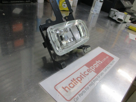 TYC Left Hand Fog Light With Mounting Frame Suits Mazda 323 Protege Sedan New Part