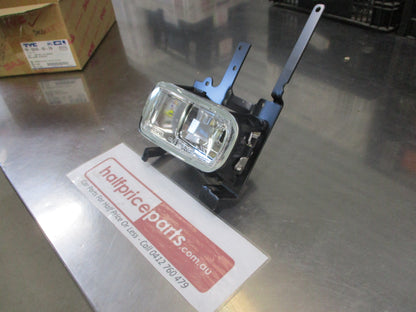 TYC Left Hand Fog Light With Mounting Frame Suits Mazda 323 Protege Sedan New Part