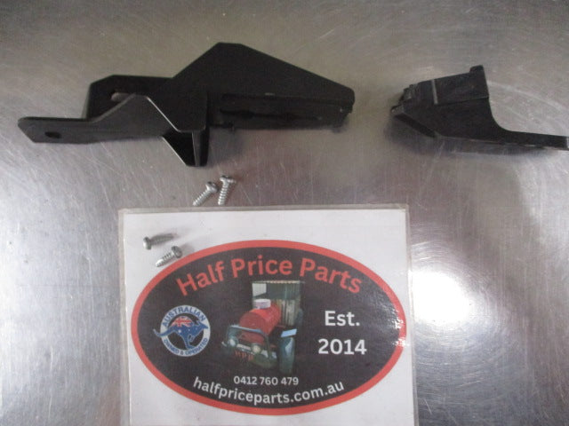 Mitsubishi Pajero Genuine left hand headlight brackets new part