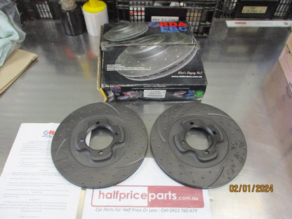 RDA Front Disc Rotor (Pair) Slotted-Dimpled Suit Mazda 323 BF 1.6Ltr Turbo/Ford Laser/TX3/TX3 Turbo/Capri New Part.