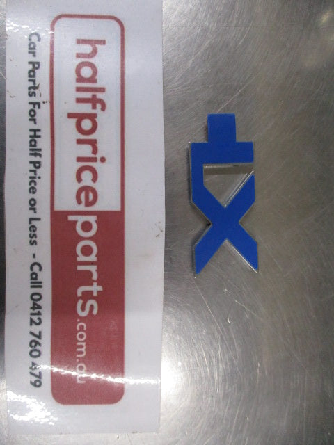 Mitsubishi Magna/Verada Genuine Chrome Xi Emblem New Part