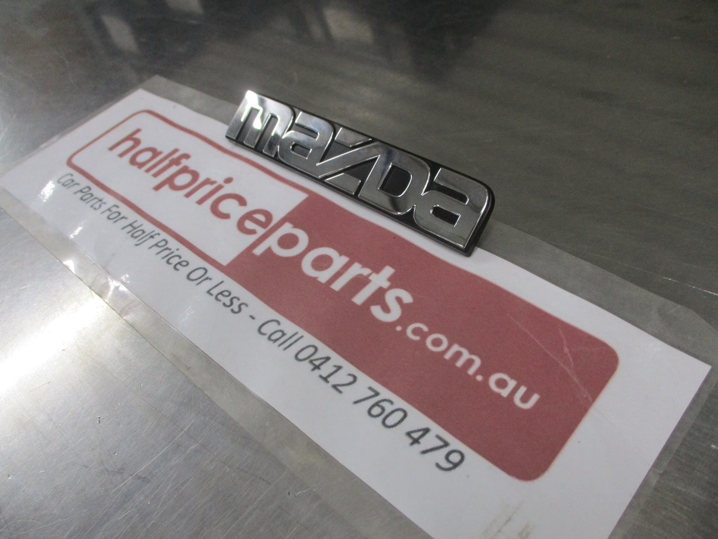 Mazda 121 Genuine Chrome Rear Boot Lid Emblem New Part