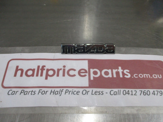 Mazda Protege Genuine Rear Emblem Badge (Chrome And Black) New Part