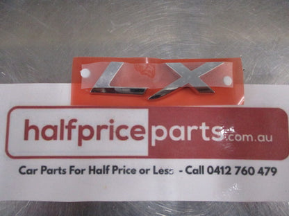 Mitsubishi Lancer Genuine Rear Chrome LX Emblem New Part