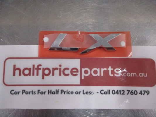 Mitsubishi Lancer Genuine Rear Chrome LX Emblem New Part