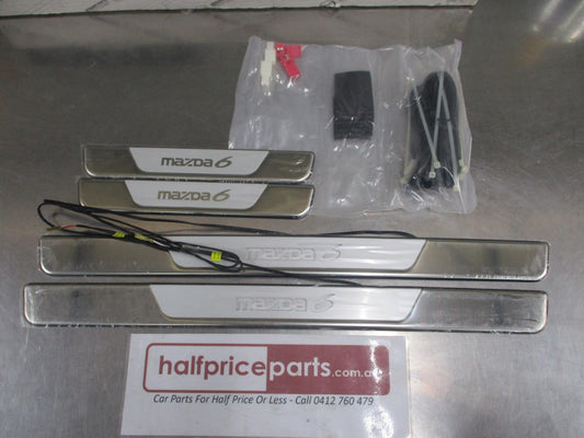 Mazda 6 Genuine Illumination Scuff Plate Set (Front And Rear) New Part