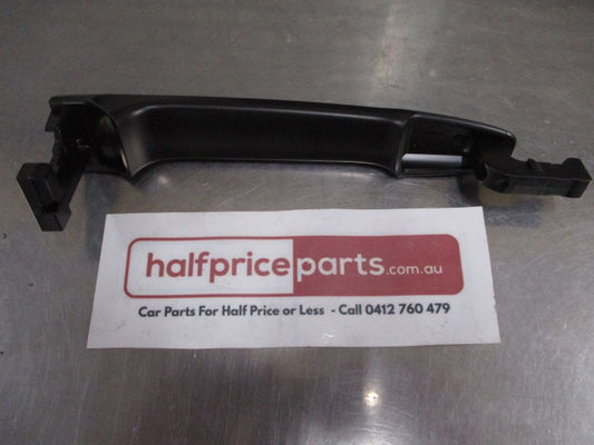Mitsubishi Lancer Genuine Left Hand Front Outside Handle (Unpainted) New Part.