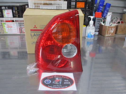 Mitsubishi Magna TJ/TL Genuine Left Hand Rear Tail Light (Passenger) New Part