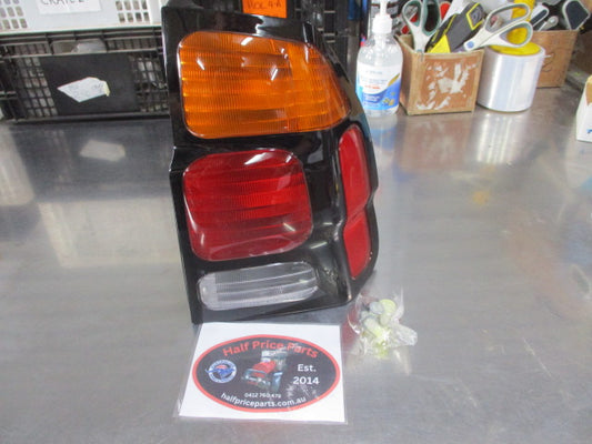 Mitsubishi Pajero Genuine Right Hand Side Combination Tail Light Assembly (Drivers) New Part