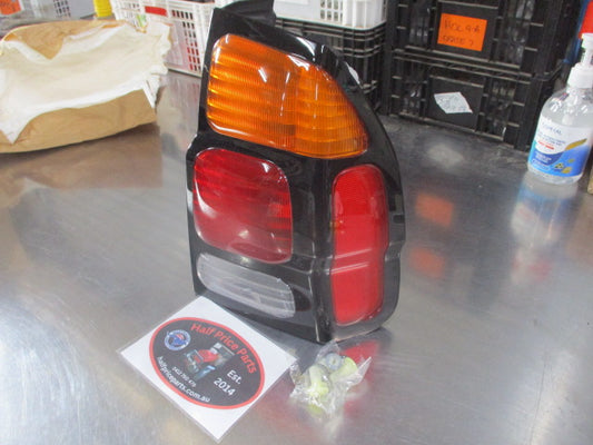 Mitsubishi Pajero Genuine Right Hand Side Combination Tail Light Assembly (Drivers) New Part