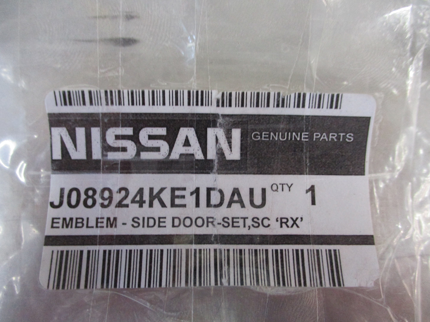 Nissan Navara RX Genuine Side Door Set Chrome Badge New Part