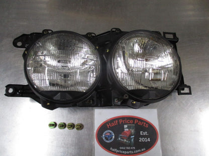 Ford Laser TX3 Genuine Right Hand Twin Head Light Assembly New Part