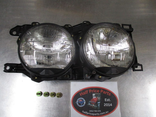 Ford Laser TX3 Genuine Right Hand Twin Head Light Assembly New Part