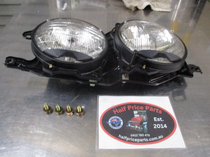 Ford Laser TX3 Genuine Right Hand Twin Head Light Assembly New Part