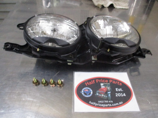 Ford Laser TX3 Genuine Right Hand Twin Head Light Assembly New Part