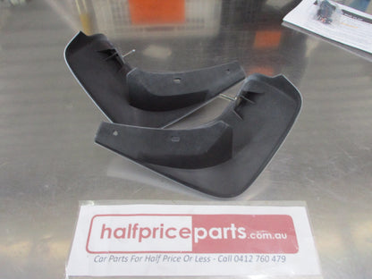 Mazda 3 Genuine Rear Mud Flap Set (In Primer) With Instructions Kit  New Part