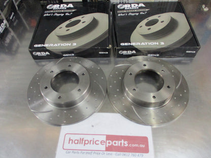 RDA Front Disc Brake Rotors (Pair) Slotted-Dimpled Suits Toyota Hilux New Part