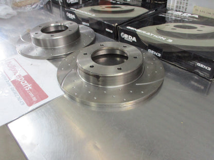 RDA Front Disc Brake Rotors (Pair) Slotted-Dimpled Suits Toyota Hilux New Part