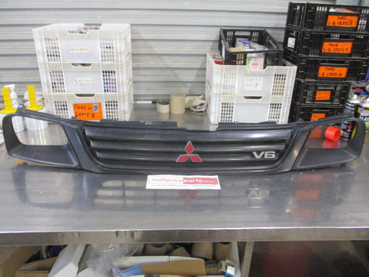 Mitsubishi MK Triton Genuine Front Grille Assembly With Head Light And Emblems Used Part