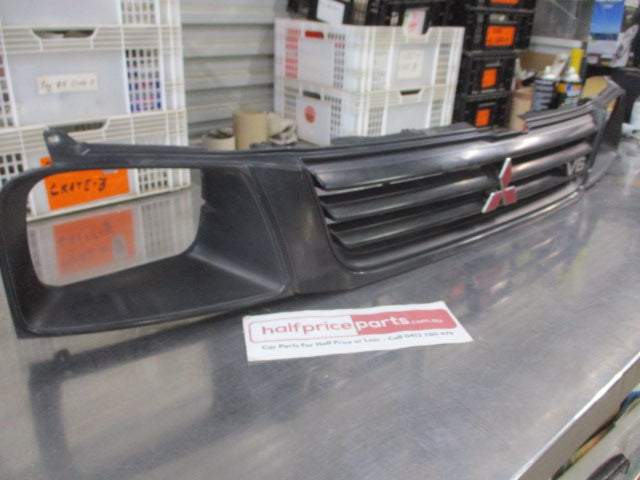 Mitsubishi MK Triton Genuine Front Grille Assembly With Head Light And Emblems Used Part
