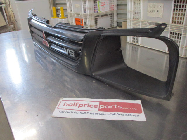 Mitsubishi MK Triton Genuine Front Grille Assembly With Head Light And Emblems Used Part