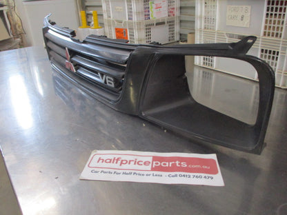 Mitsubishi MK Triton Genuine Front Grille Assembly With Head Light And Emblems Used Part