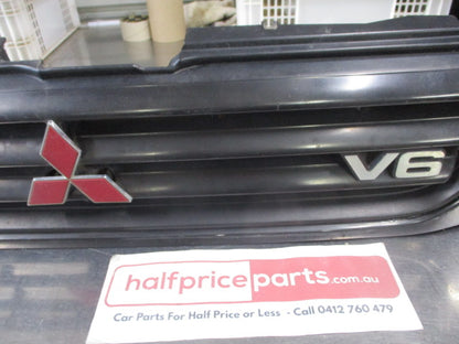 Mitsubishi MK Triton Genuine Front Grille Assembly With Head Light And Emblems Used Part